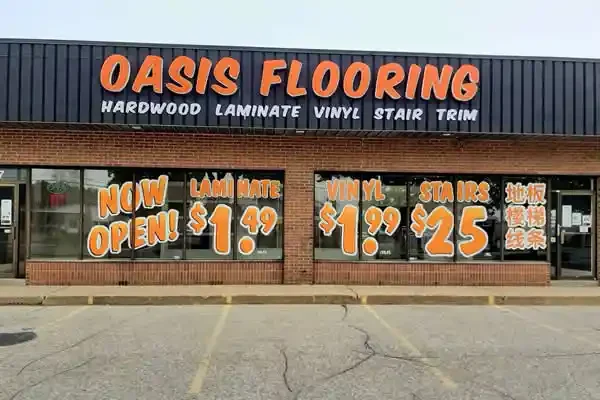 Oasis Flooring storefront sign and window graphics
